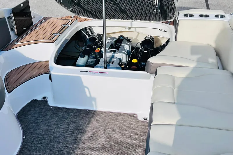 Slide: The Image of 2019 Bryant POTENZA 270 boat engine compartment with seating and teak accents. - 53