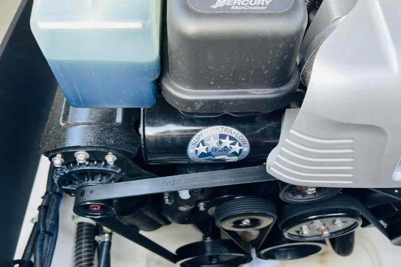 Slide: The Image of Close-up of a 2019 Bryant POTENZA 270 engine with visible components and labels. - 58