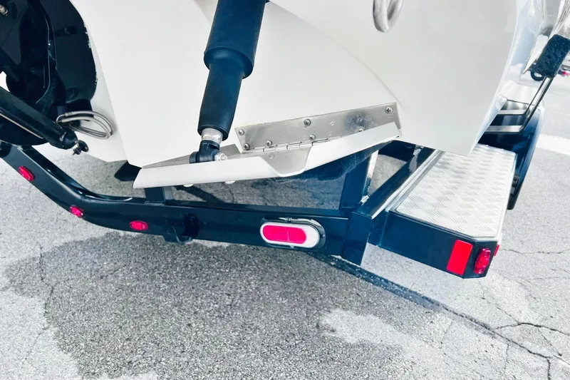Slide: The Image of Rear view of a 2019 Bryant POTENZA 270 boat trailer with hydraulic components. - 62