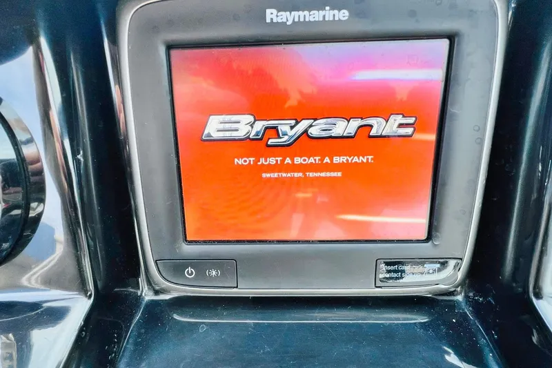 Slide: The Image of Raymarine display showing Bryant logo on 2019 POTENZA 270 boat dashboard. - 64