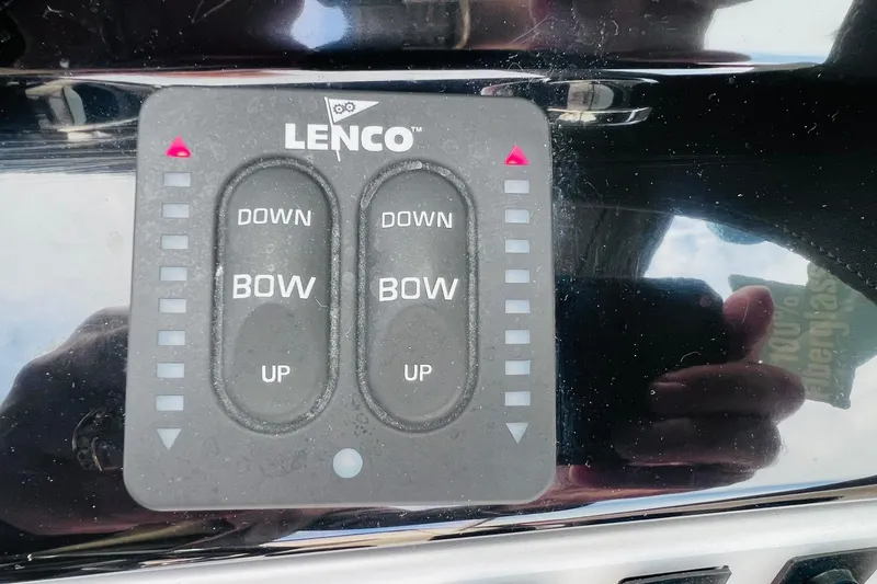Slide: The Image of Control panel of a 2019 Bryant POTENZA 270 boat with Lenco trim tab switches. - 69