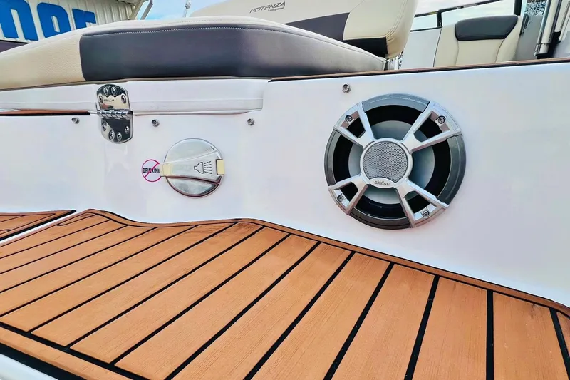 Slide: The Image of 2019 Bryant POTENZA 270 boat interior with speaker and teak flooring. - 79