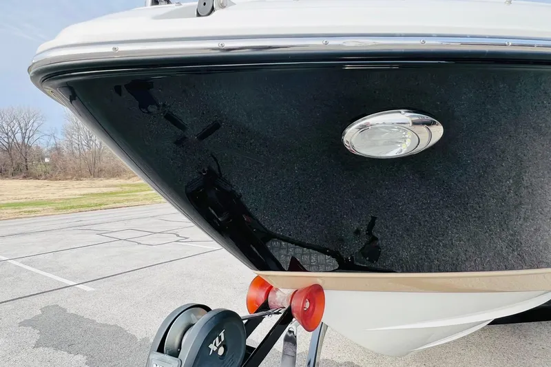 Slide: The Image of 2019 Bryant Potenza boat front view on trailer in parking lot. - 83