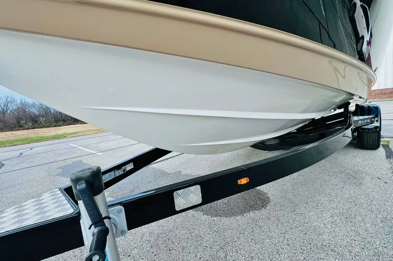 Slide: The Image of 2019 Bryant POTENZA 270 boat on trailer, showcasing sleek hull design. - 85