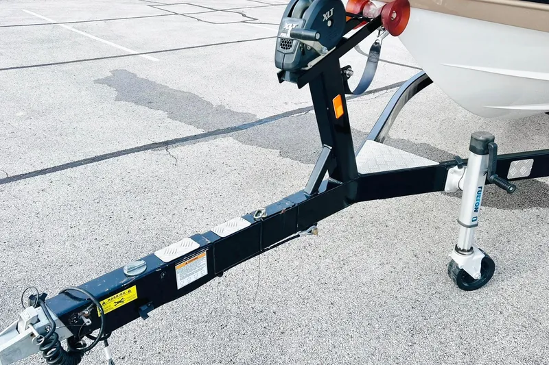 Slide: The Image of Trailer hitch of a 2019 Bryant POTENZA 270 boat on a parking lot. - 91