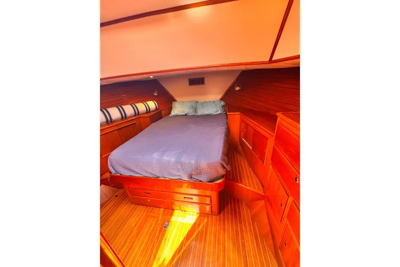 Slide: The Image of Helm of 2000 Grand Banks East Bay 49 yacht with marina view. - 16