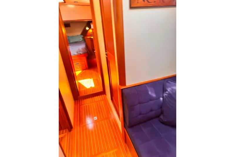 Slide: The Image of Luxurious 2000 Grand Banks East Bay 49 yacht interior with wood finish and cozy seating area. - 17