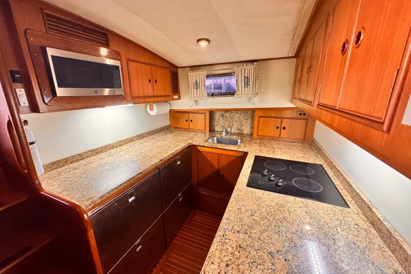 Slide: The Image of Interior of 2000 Grand Banks East Bay 49 yacht with wooden furnishings. - 26