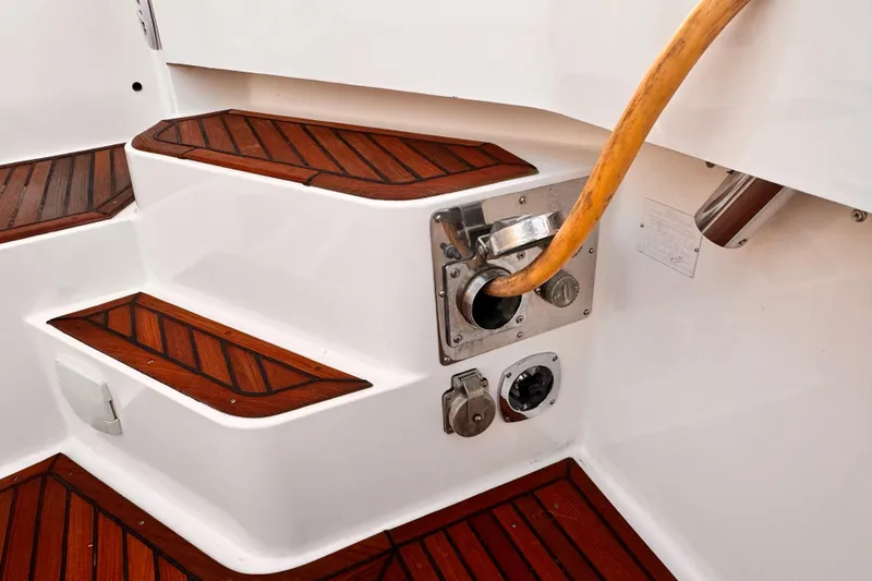 Slide: The Image of Helm of 2000 Grand Banks East Bay 49 yacht with harbor view. - 30