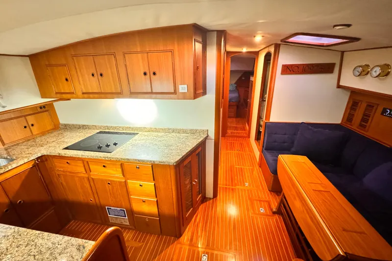 Slide: The Image of Interior of 2000 Grand Banks East Bay 49 yacht with wooden furnishings. - 25