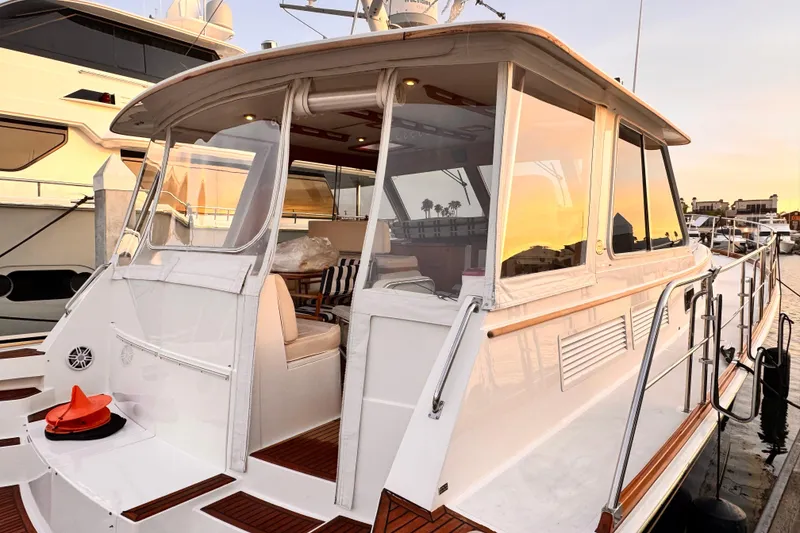 Slide: The Image of Grand Banks East Bay 49 yacht, 2000 model, docked at sunset. - 34