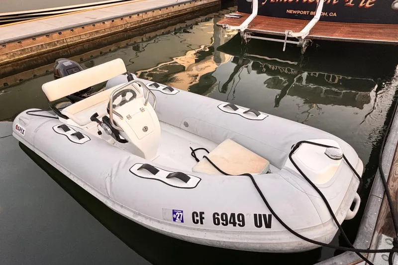 Slide: The Image of Inflatable dinghy beside Grand Banks East Bay 49, year 2000. - 37