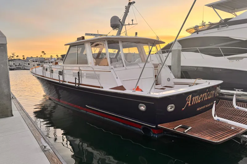 Slide: The Image of 2000 Grand Banks East Bay 49 yacht docked at sunset. - 38