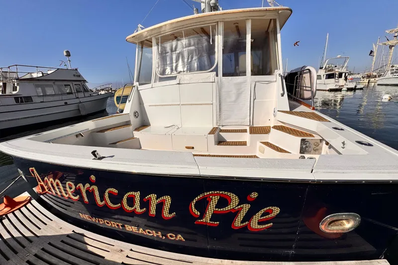 Slide: The Image of 2000 Grand Banks East Bay 49 yacht docked at Newport Beach, CA, named "American Pie". - 4