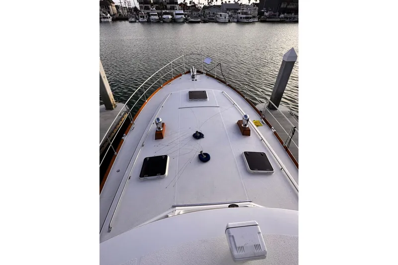Slide: The Image of Deck view of 2000 Grand Banks East Bay 49 yacht in harbor. - 41