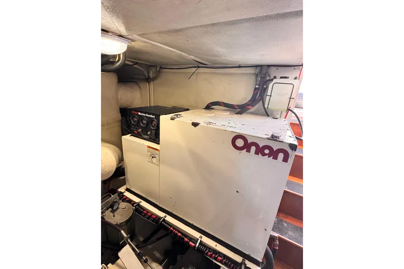 Slide: The Image of Onan marine generator in 2000 Grand Banks East Bay 49. - 44