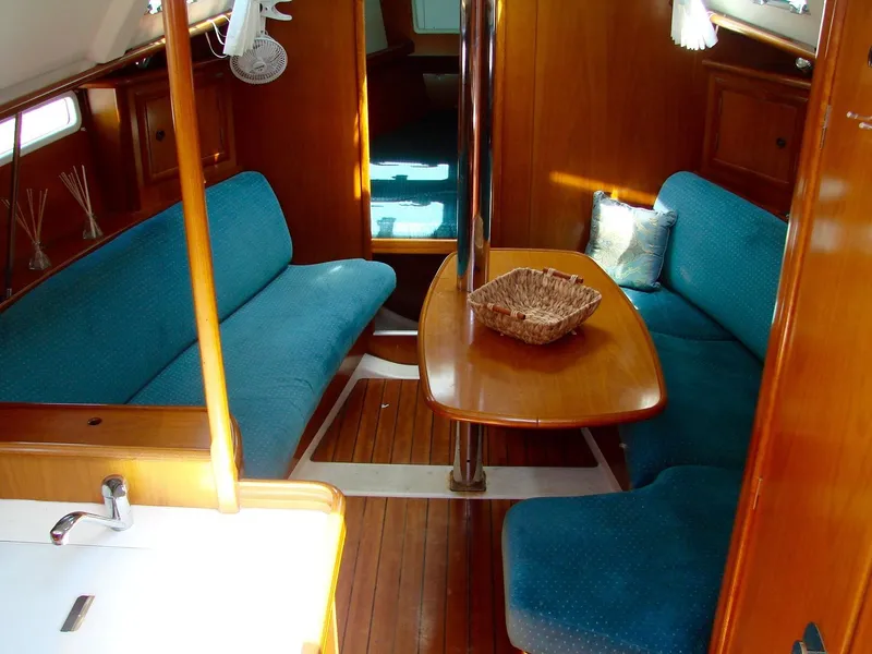 Slide: The Image of Interior of a 2001 Beneteau 331 yacht with blue upholstery. - 13