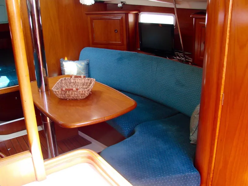 Slide: The Image of Interior of a 2001 Beneteau 331 yacht with blue upholstery. - 14