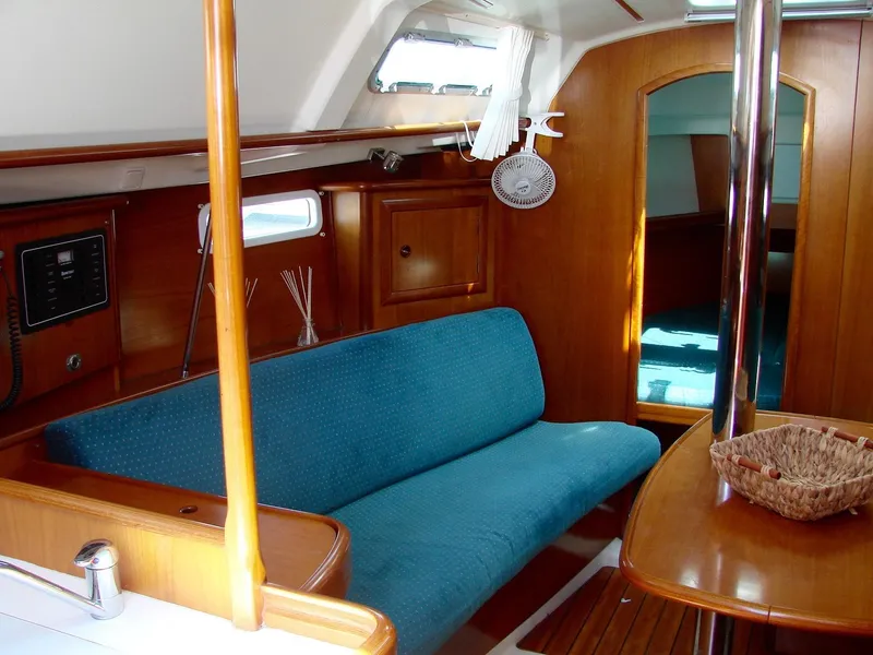 Slide: The Image of Interior of a 2001 Beneteau 331 yacht with blue upholstery. - 15