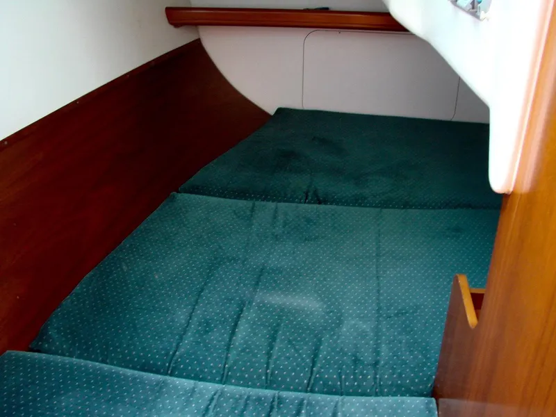 Slide: The Image of Interior of 2001 Beneteau 331 featuring wooden cabinet. - 18
