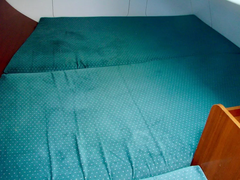 Slide: The Image of Interior of a 2001 Beneteau 331 yacht with green upholstery. - 19