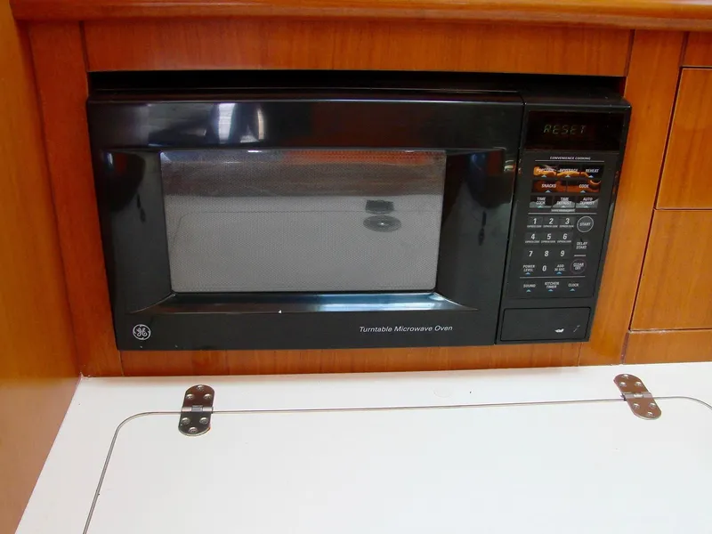 Slide: The Image of Galley area of a 2001 Beneteau 331 with stainless steel stove. - 25
