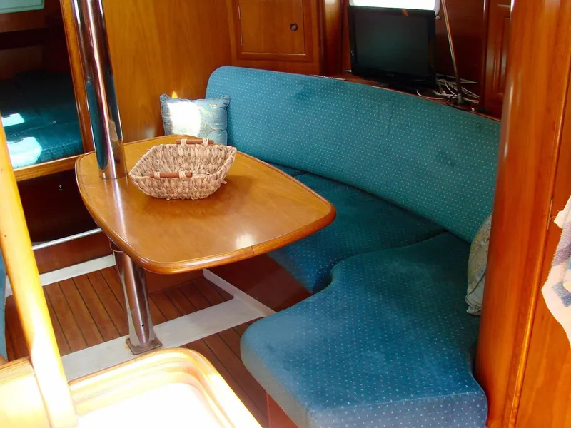 Slide: The Image of Interior of a 2001 Beneteau 331 yacht with blue upholstery. - 30