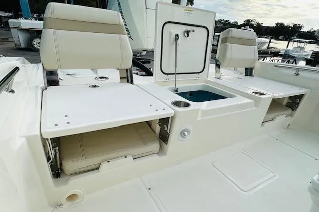 Slide: The Image of 2025 Boston Whaler 250 Dauntless boat interior with seating and storage compartments. - 12
