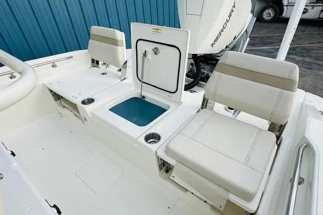Slide: The Image of 2025 Boston Whaler 250 Dauntless boat interior with seating and storage compartments. - 14