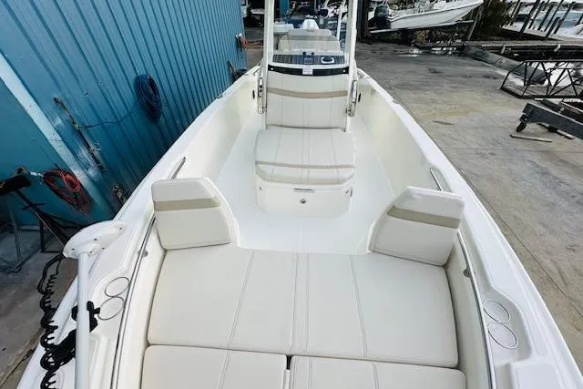 Slide: The Image of 2025 Boston Whaler 250 Dauntless boat with spacious seating and sleek design. - 21