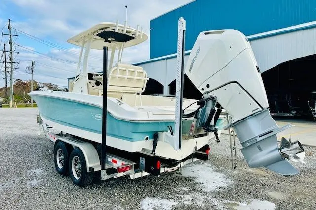 Slide: The Image of 2025 Boston Whaler 250 Dauntless boat on trailer, featuring a powerful Mercury outboard engine. - 4