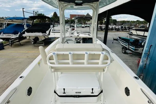 Slide: The Image of 2025 Boston Whaler 250 Dauntless boat interior with seating and rod holders. - 9