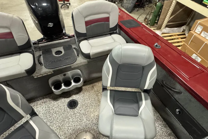 Slide: The Image of 2014 Tracker Targa V-18 Combo boat interior with gray and red seating. - 10