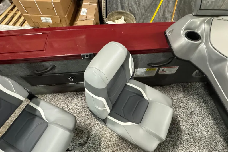 Slide: The Image of 2014 Tracker Targa V-18 Combo boat interior with gray seats and red trim. - 11