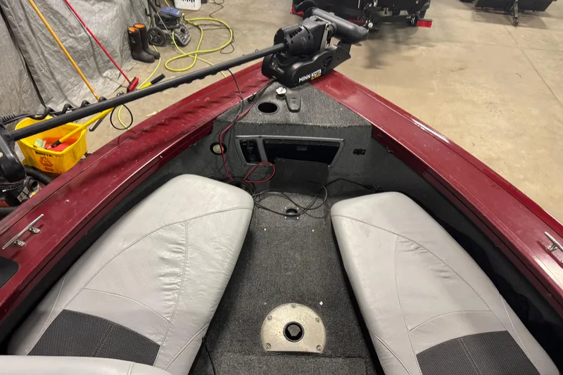 Slide: The Image of 2014 Tracker Targa V-18 Combo boat interior with Minn Kota trolling motor. - 13