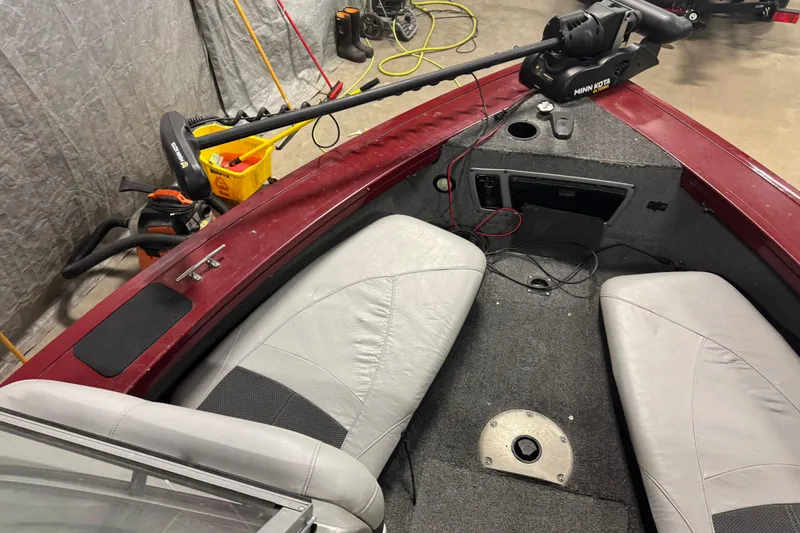 Slide: The Image of 2014 Tracker Targa V-18 Combo boat interior with Minn Kota trolling motor. - 14