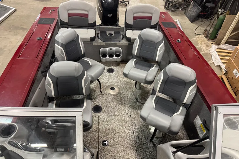 Slide: The Image of 2014 Tracker Targa V-18 Combo boat interior with six gray and black seats. - 17