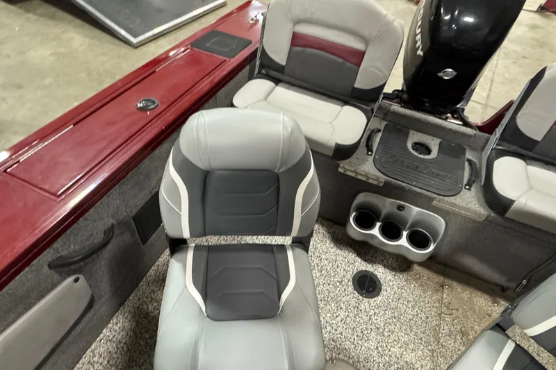 Slide: The Image of 2014 Tracker Targa V-18 Combo boat interior with gray and red seating. - 9