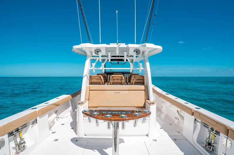 Slide: The Image of Manufacturer Provided Image: 2025 Caymas 44 CT boat on open sea, featuring luxurious seating and fishing amenities. - 5