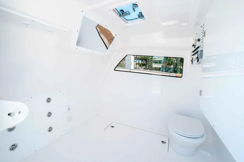 Slide: The Image of Manufacturer Provided Image: Interior of 2025 Caymas 44 CT boat featuring modern white design and amenities. - 8