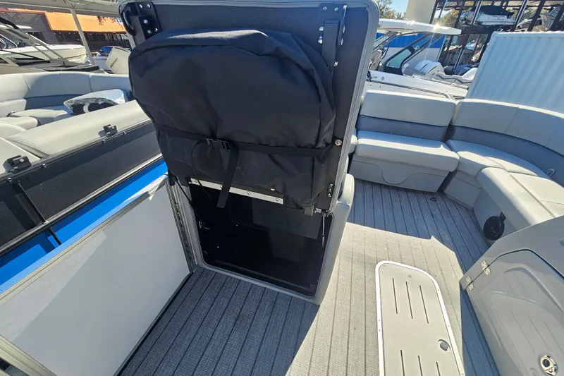 Slide: The Image of 2026 Bentley Pontoons Legacy 223 Swingback interior with seating and storage compartment. - 11