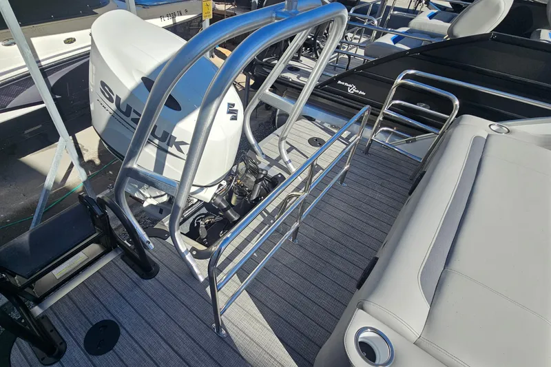 Slide: The Image of 2026 Bentley Pontoons Legacy 223 Swingback with Suzuki engine, featuring sleek deck design. - 19