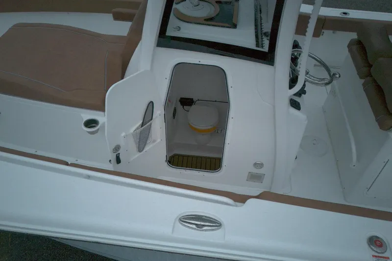 Slide: The Image of 2026 Sea Hunt Ultra 285 Coffin Box boat interior with open hatch and seating. - 10