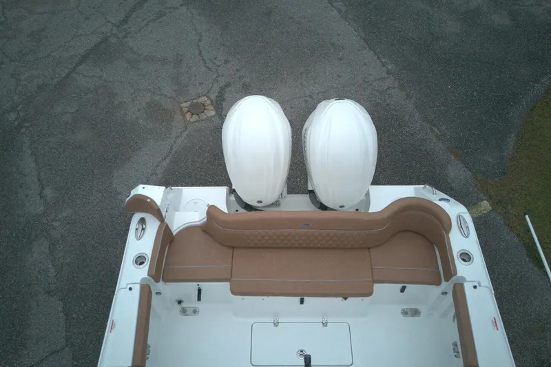 Slide: The Image of 2026 Sea Hunt Ultra 285 Coffin Box boat with dual engines, aerial view. - 11