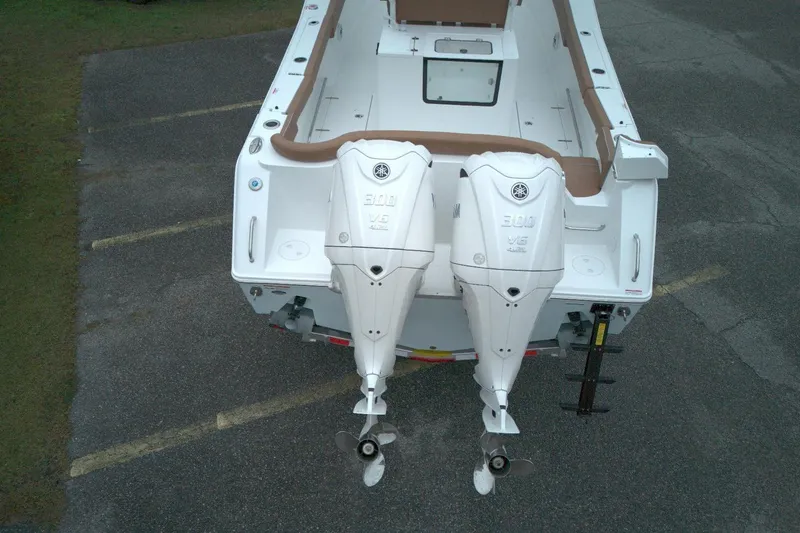 Slide: The Image of 2026 Sea Hunt Ultra 285 Coffin Box with dual outboard engines, aerial view. - 3