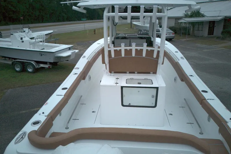 Slide: The Image of 2026 Sea Hunt Ultra 285 Coffin Box boat with spacious deck and rod holders. - 7