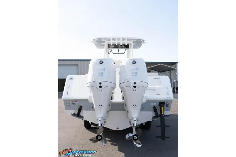 Slide: The Image of 2026 Sea Hunt Gamefish 30 Coffin Box with dual outboard engines, rear view. - 25