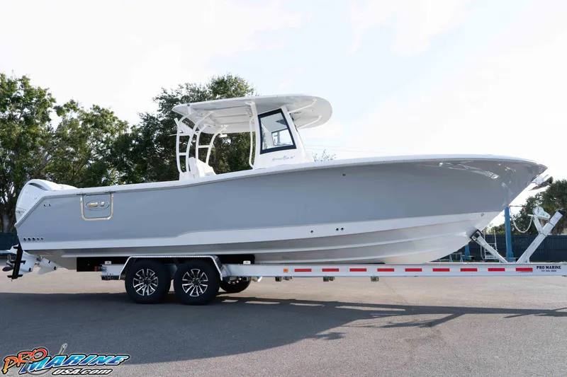 Slide: The Image of 2026 Sea Hunt Gamefish 30 Coffin Box boat on trailer, side view. - 27