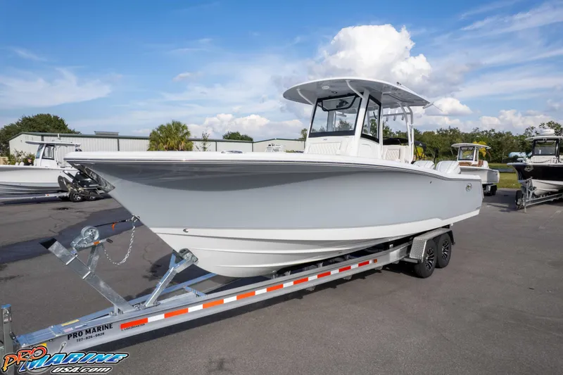 Slide: The Image of 2026 Sea Hunt Gamefish 30 Coffin Box boat on trailer, parked outdoors. - 6