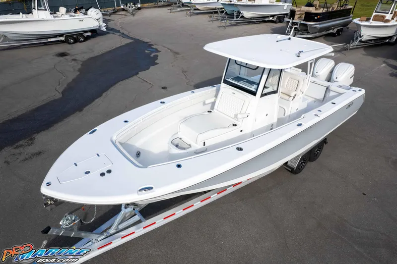 Slide: The Image of 2026 Sea Hunt Gamefish 30 Coffin Box boat on trailer, displayed outdoors. - 7